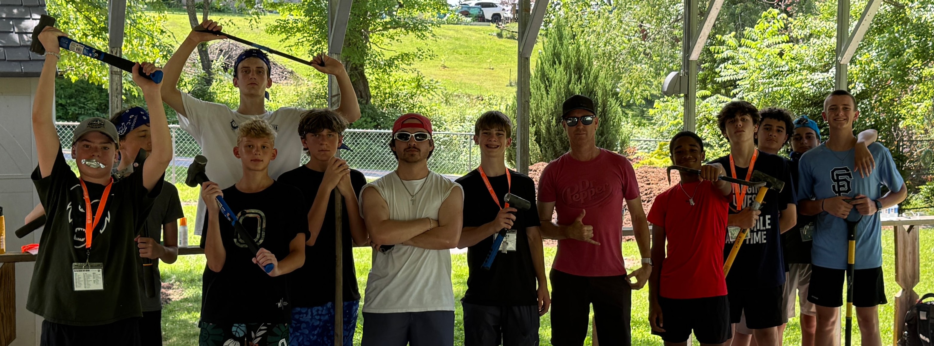 A group building a shed together at camp